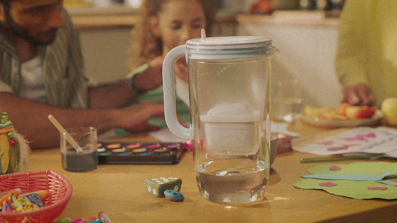 Glass water filter jug shown from multiple angles